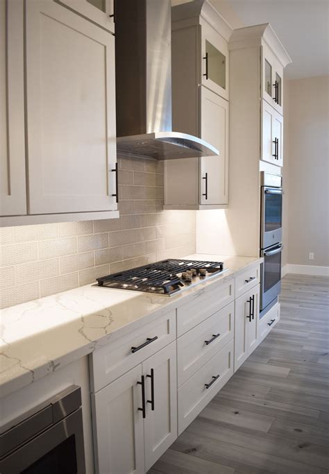 white shaker cabinets with black stainless steel appliances|pulls for white shaker cabinets.